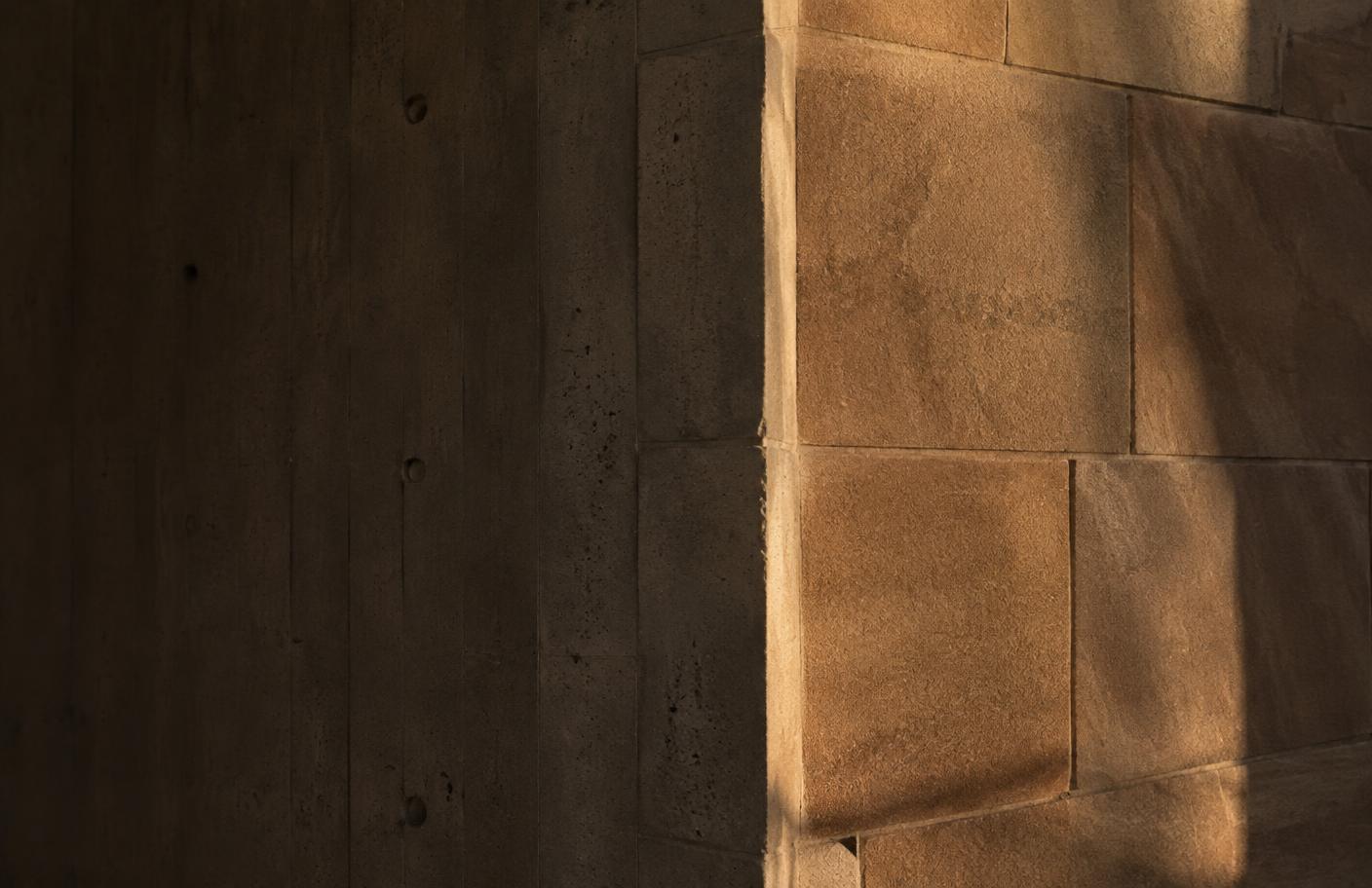 Concrete and sandstone wall in low afternoon light